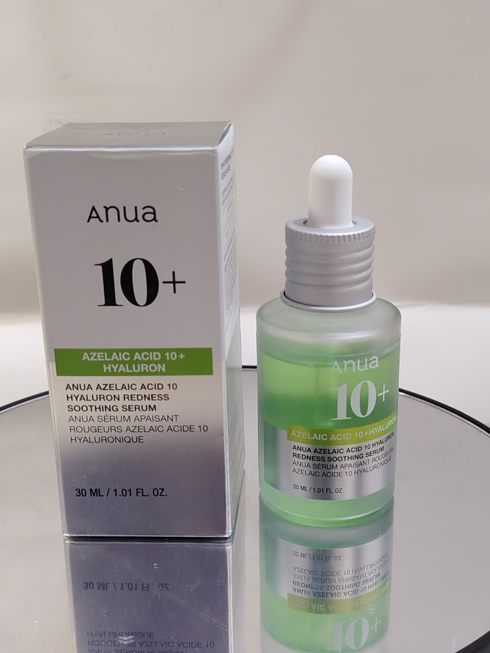 Anua Azelaic Acid 10% + Hyaluron Soothing Serum bottle with dropper on a neutral background