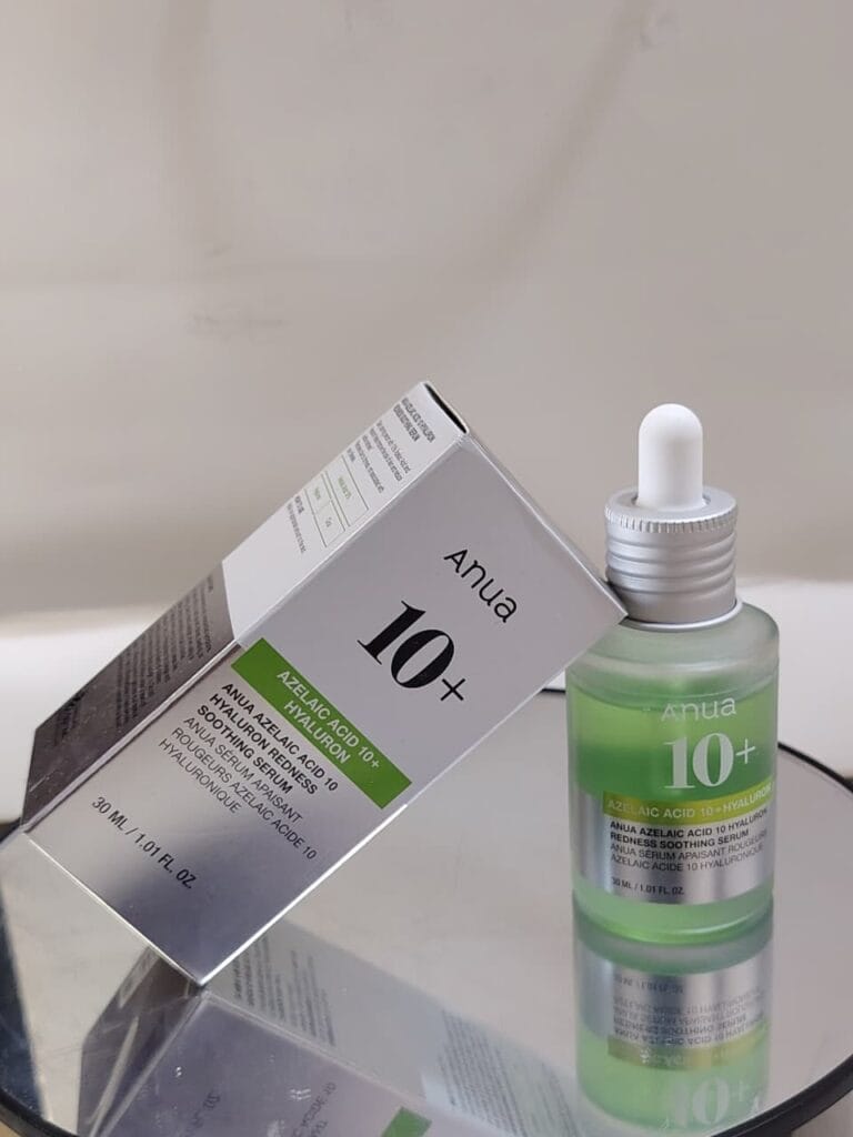 Anua Azelaic Acid 10% + Hyaluron Soothing Serum bottle with dropper displayed next to the product box on a neutral background