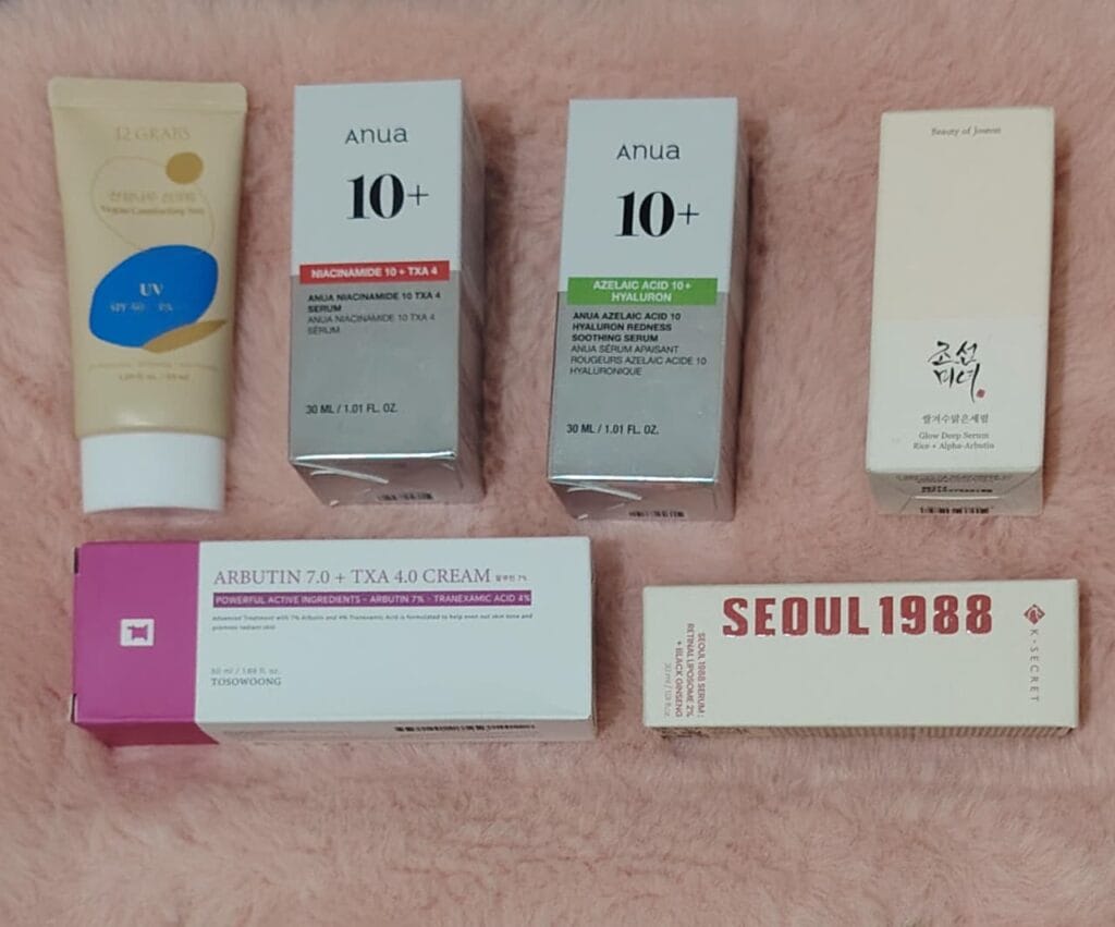 Ingredients for dark spots in Kenya including niacinamide, azelaic acid, alpha arbutin, tranexamic acid, retinol, sunscreen, and vitamin C serum.